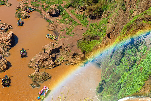 Tanaghmeilt, Morocco - Colorful Boats going to Ouzoud Waterfall. Waterfalls are located in the Grand Atlas province of Azilal, 150 km northeast of Marrakech and are famous tourist destination. North Africa, Nikon D3x