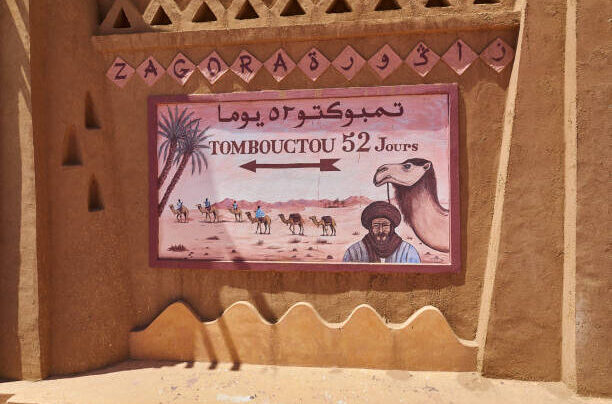 iconic road sign of traveling distance to Tombouctou in Mali from Zagora in Morocco.